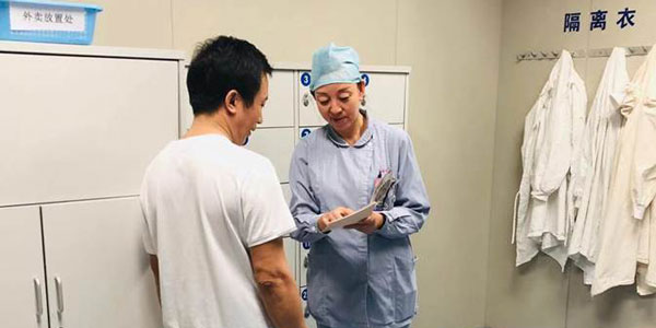 A nurse educating a family member