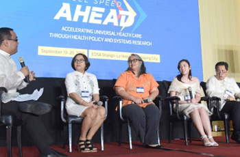 Panel of participants on a stage