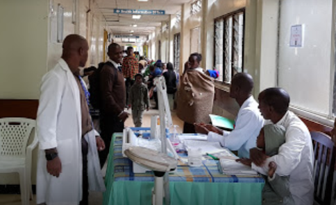 Hospital corridor filled with patients and health workers