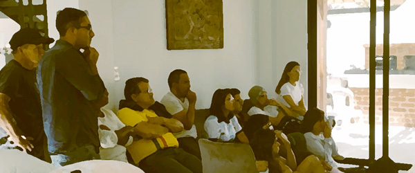 A group of people watch social media posts from health experts