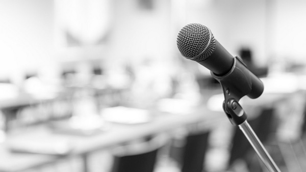 Microphone on a stand with a classroom in the background